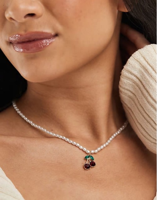 pearl beaded necklace with cherry pendant in white