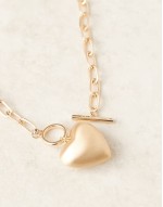 necklace with t-bar and puff heart charm detail in gold tone