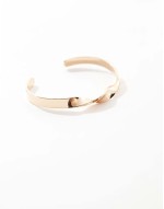 cuff bracelet with twisted detail in gold tone